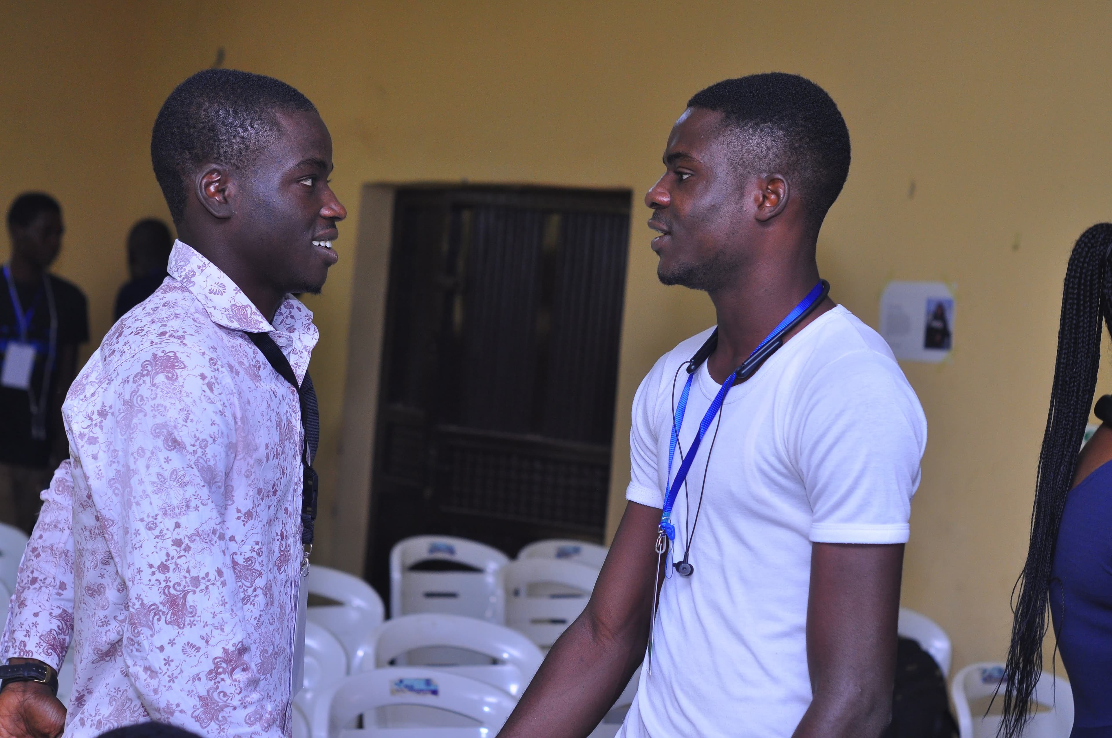Two attendees meeting in the hall at DevFest Ogbomoso 2019