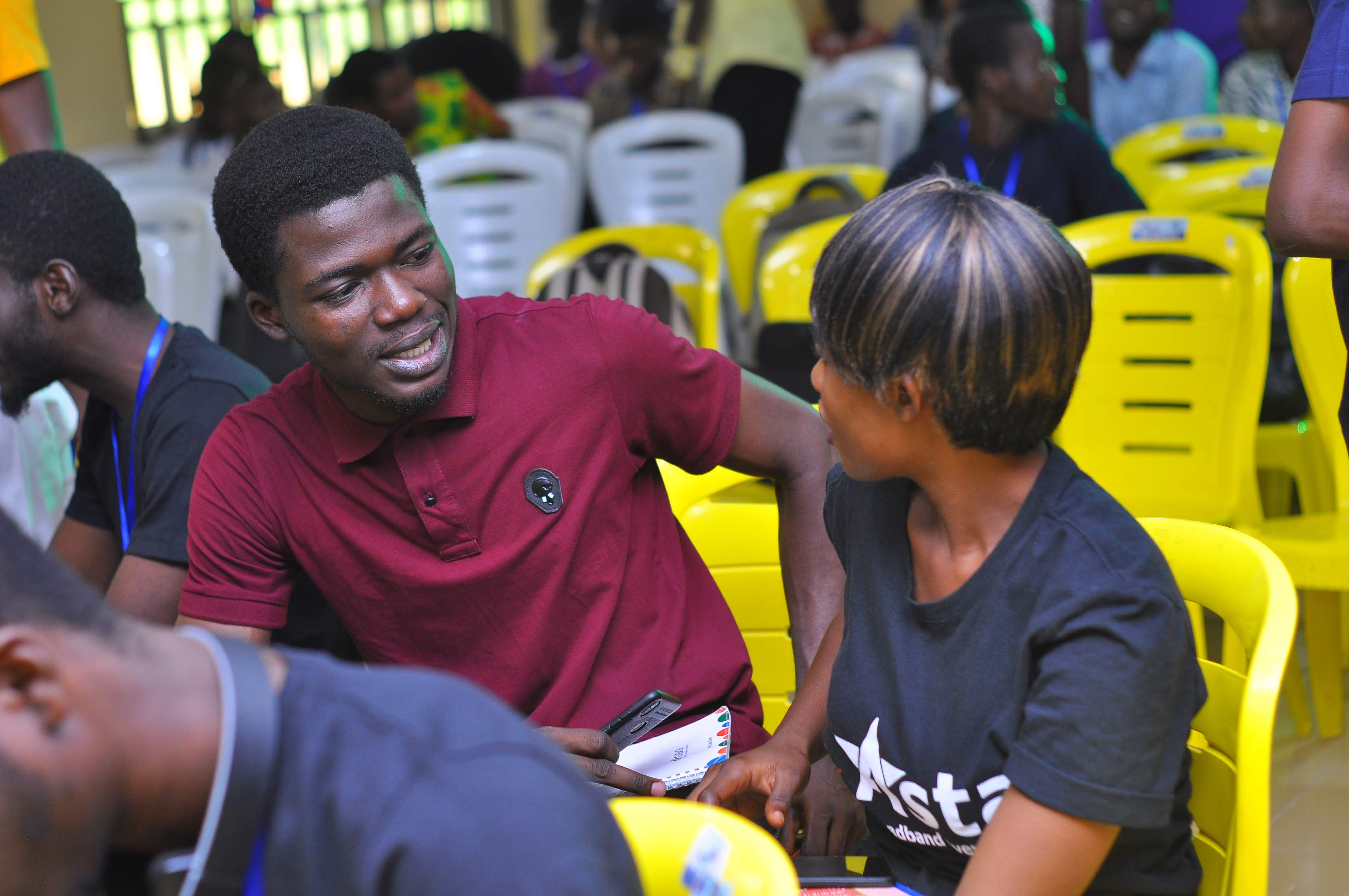 Attendees sharing a conversation at DevFest Ogbomoso 2019
