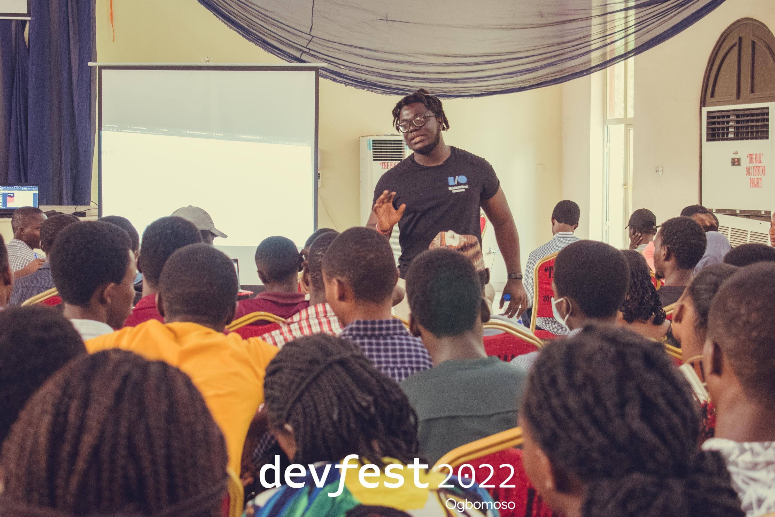 A speaker standing in front of the seated audience at DevFest Ogbomoso 2022
