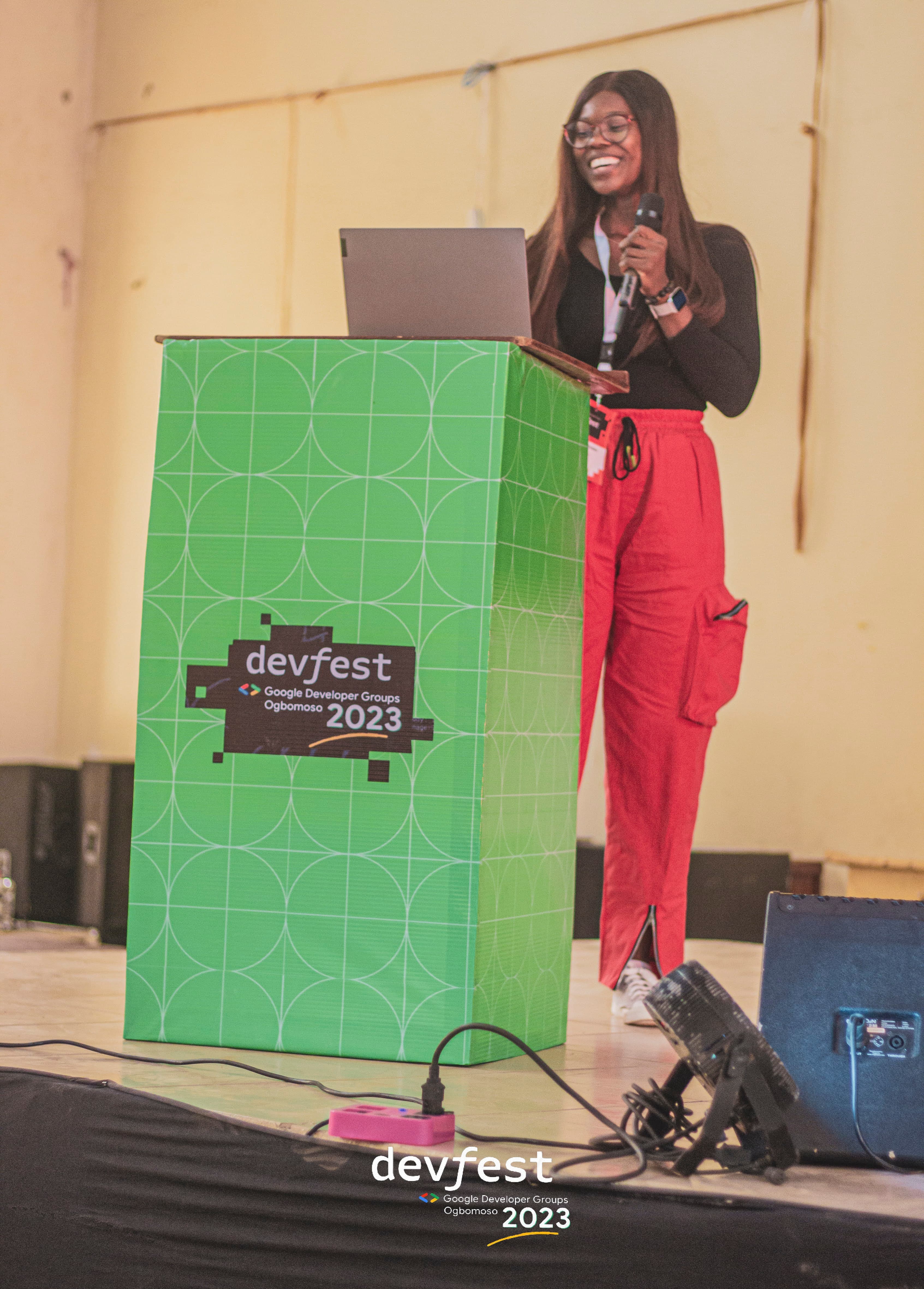A presenter at the conference podium at DevFest Ogbomoso 2023