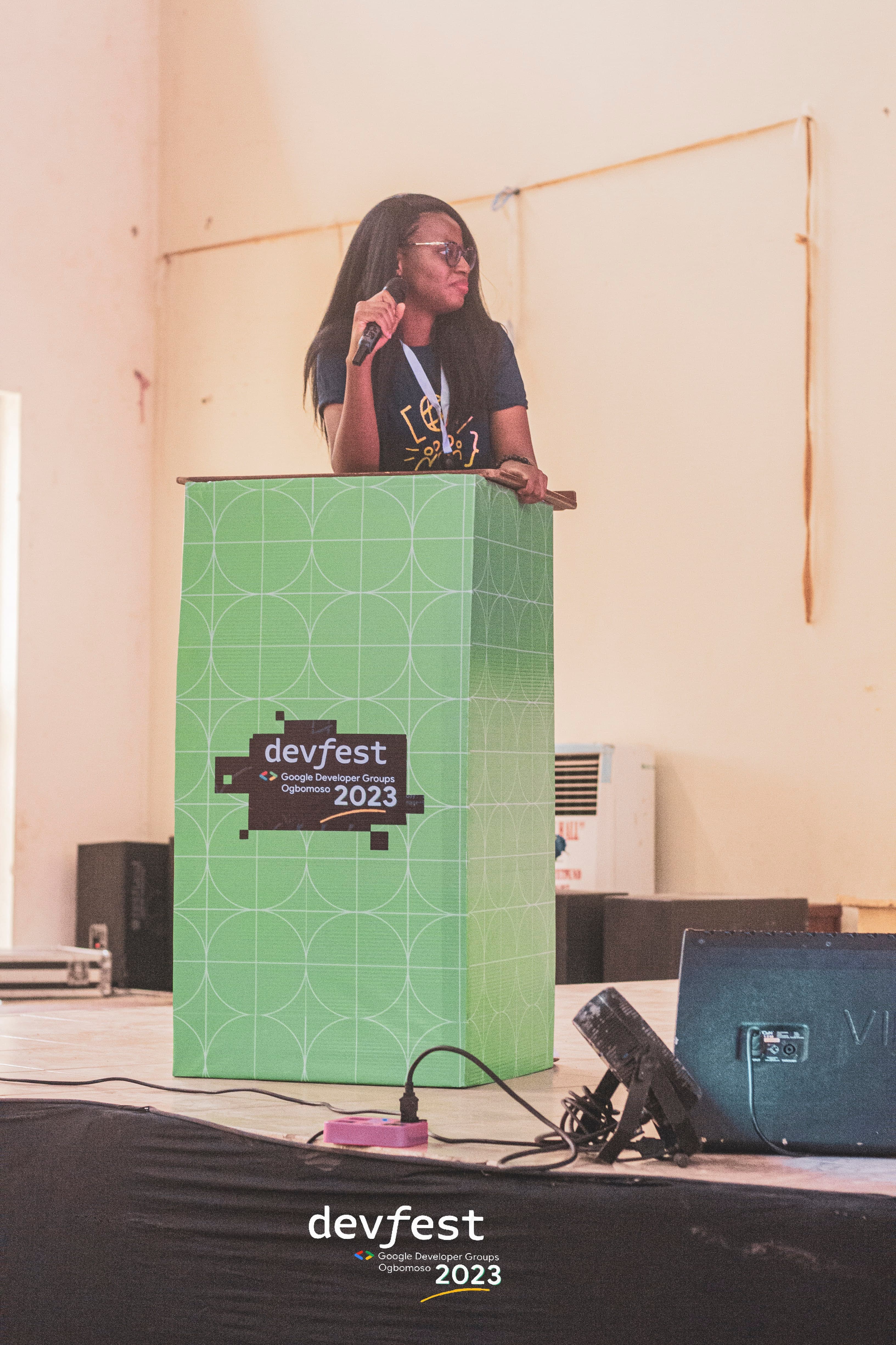 A speaker at the DevFest podium at DevFest Ogbomoso 2023